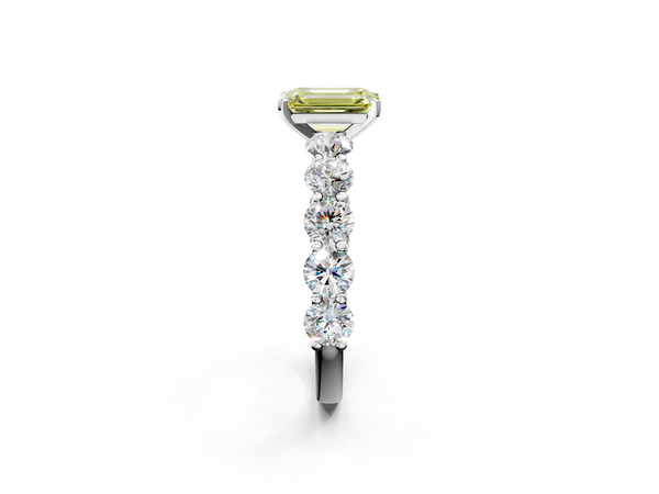 White gold Fancy Yellow Emerald Cut Diamond Prong Setting with Side Stones on a Pave Band