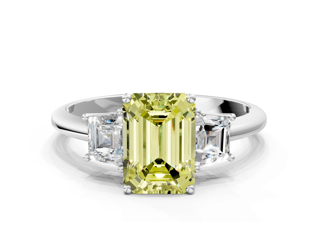 18K White Gold 5.03 Carat Yellow VVS2 Emerald Diamond Three-Stone Ring with Trapezoid Side Stones and Prong Setting