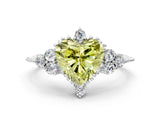 White gold Fancy Yellow Heart Cut Brilliant Diamond with Cluster Setting on a Beaded Band and Four-Prong Setting