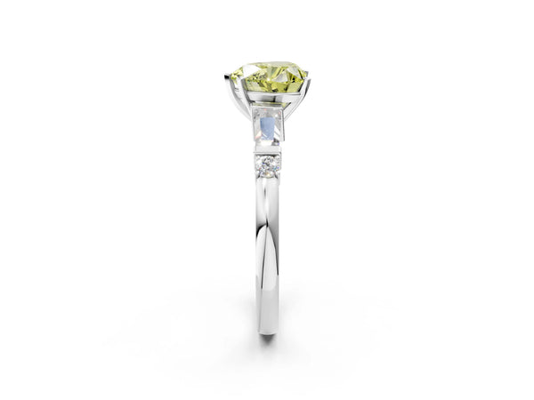 White gold Fancy Yellow Heart  Cut Diamond Ring with Baguette Side Stones, Channel Set Band, and Four-Prong Setting