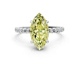 White gold Fancy Yellow Marquise Cut Diamond Brilliant Solitaire Ring with Pavé Band and Four-Prong Setting