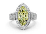 White gold Fancy Yellow Marquise Cut Diamond Halo Ring with Split Shank and Bezel Accents and Prong Setting
