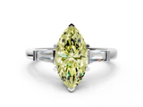 White gold Fancy Yellow Marquise  Cut Diamond Solitaire Ring with Tapered Baguette Accents and Four-Prong Setting