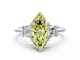 White gold Fancy Yellow Marquise  Diamond Three-Stone Ring with Trapezoid Side Stones and Prong Setting