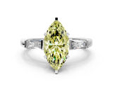 White gold Fancy Yellow Marquise  Solitaire with Tapered Baguette Side Stones on a Classic Band with Four-Prong Setting