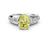 White gold Fancy Yellow Oval  Brilliant Solitaire with Side Stones on a Pave Band and Four-Prong Setting_30