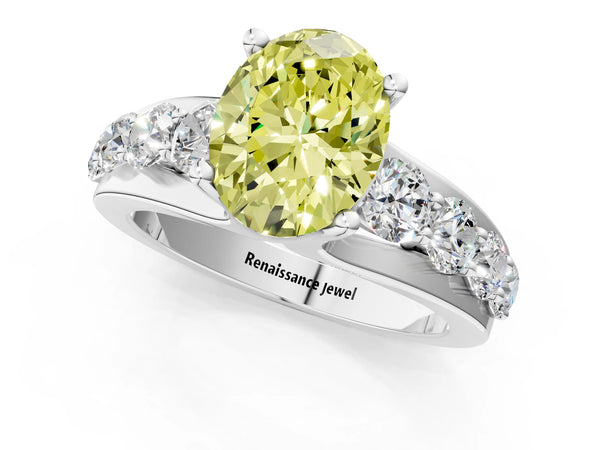 White gold Fancy Yellow Oval  Brilliant Solitaire with Side Stones on a Pave Band and Four-Prong Setting