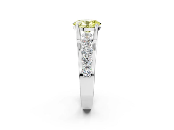 White gold Fancy Yellow Oval  Brilliant Solitaire with Side Stones on a Pave Band and Four-Prong Setting