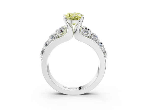 White gold Fancy Yellow Oval  Brilliant Solitaire with Side Stones on a Pave Band and Four-Prong Setting