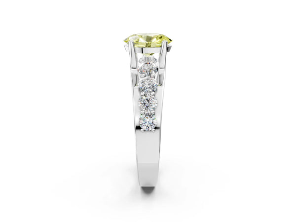 White gold Fancy Yellow Oval  Brilliant Solitaire with Side Stones on a Pave Band and Four-Prong Setting