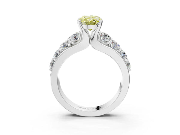 White gold Fancy Yellow Oval  Brilliant Solitaire with Side Stones on a Pave Band and Four-Prong Setting