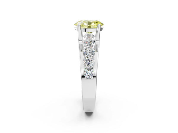 White gold Fancy Yellow Oval  Brilliant Solitaire with Side Stones on a Pave Band and Four-Prong Setting