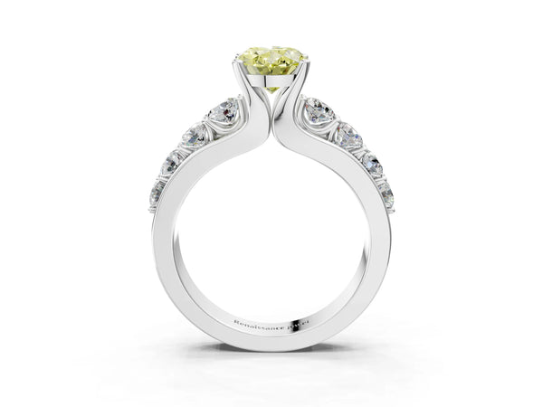 White gold Fancy Yellow Oval  Brilliant Solitaire with Side Stones on a Pave Band and Four-Prong Setting