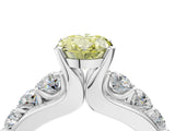 White gold Fancy Yellow Oval  Brilliant Solitaire with Side Stones on a Pave Band and Four-Prong Setting_88