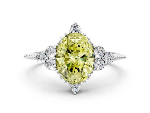White gold Fancy Yellow Oval Cut Brilliant Diamond with Cluster Setting on a Beaded Band and Four-Prong Setting