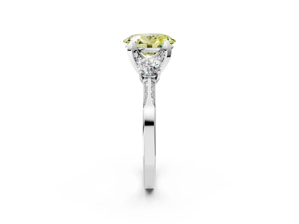 White gold Fancy Yellow Oval Cut Brilliant Three-Stone Diamond Ring with Pavé Band and Four-Prong Setting