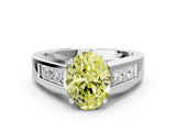White gold Fancy Yellow Oval Cut Cut Channel Set Solitaire Ring with Four-Prong Setting
