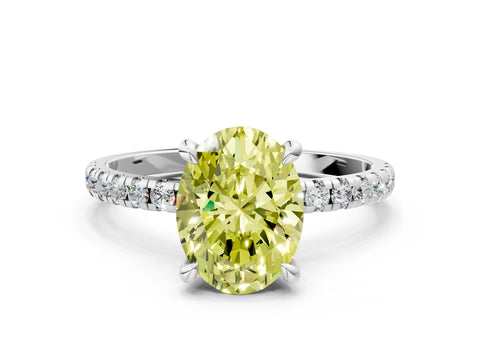 White gold Fancy Yellow Oval Cut Diamond Brilliant Solitaire Ring with Pavé Band and Four-Prong Setting