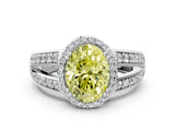 White gold Fancy Yellow Oval Cut Diamond Halo Ring with Split Shank Pavé Band and Four-Prong Setting