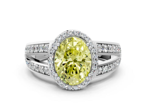 White gold Fancy Yellow Oval Cut Diamond Halo Ring with Split Shank Pavé Band and Four-Prong Setting