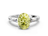 White gold Fancy Yellow Oval  Cut Diamond Ring with Tapered Baguette Side Stones in Four-Prong Setting_3