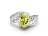 White gold Fancy Yellow Oval Cut Diamond Solitaire Ring with Prong Setting and Twisted Pavé Band