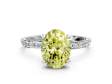 White gold Fancy Yellow Oval Cut Diamond Solitaire Ring with Round  Pavé Band and Prong Setting_181