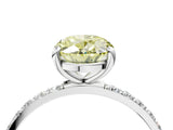 White gold Fancy Yellow Oval Cut Diamond Solitaire Ring with Round  Pavé Band and Prong Setting_185