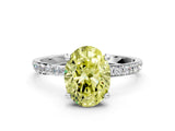 White gold Fancy Yellow Oval Cut Diamond Solitaire Ring with Round  Pavé Band and Prong Setting_187