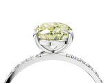 White gold Fancy Yellow Oval Cut Diamond Solitaire Ring with Round  Pavé Band and Prong Setting_191