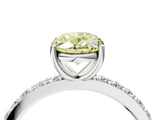 White gold Fancy Yellow Oval  Cut Diamond Solitaire with Pave Band and Four-Prong Setting