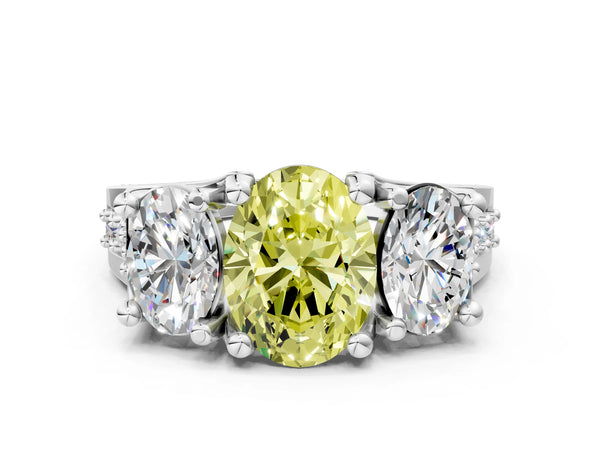 White gold Fancy Yellow Oval Cut Diamond Three-Stone Ring with Channel Set Band and Four-Prong Setting