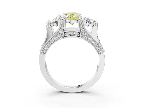 White gold Fancy Yellow Oval Cut Diamond Three-Stone Ring with Channel Set Band and Four-Prong Setting