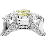 White gold Fancy Yellow Oval Cut Diamond Three-Stone Ring with Channel Set Band and Four-Prong Setting_82
