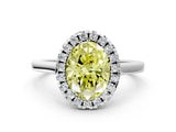 White gold Fancy Yellow Oval Cut Halo Round Diamond Solitaire Ring with Pavé Band and Four-Prong Setting