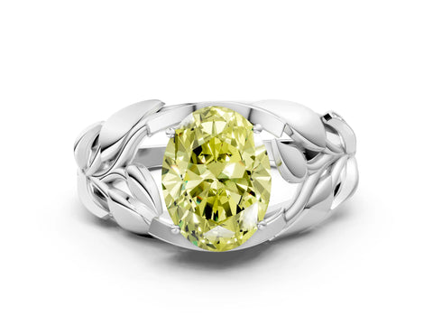 White gold Fancy Yellow Oval Cut Solitaire Leaf-Inspired Engagement Ring with Prong Setting