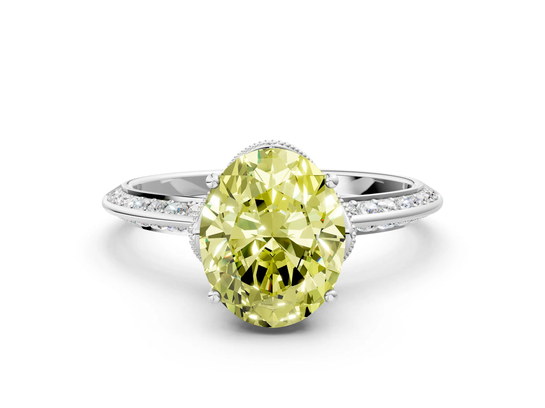 White gold Fancy Yellow Oval Cut Solitaire Split Shank Pave Diamond Engagement Ring with Four-Prong Setting