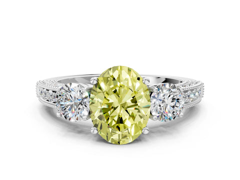 White gold Fancy Yellow Oval Cut Three-Stone Diamond Ring with Pavé Band and Four-Prong Setting