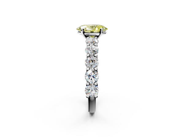 White gold Fancy Yellow Oval Cut Diamond Prong Setting with Side Stones on a Pave Band