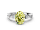 White gold Fancy Yellow Oval  Solitaire with Tapered Baguette Side Stones on a Classic Band with Four-Prong Setting_86