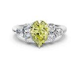 White gold Fancy Yellow Pear  Cut Diamond Cluster Ring with Round Accent Stones and Prong Setting on a Classic Band_39