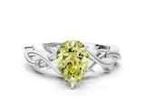 White gold Fancy Yellow Pear Cut Diamond Solitaire Ring with Twisted Band and Prong Setting_230
