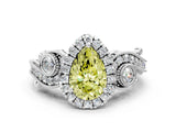 White gold Fancy Yellow Pear Cut Halo Diamond Ring with Milgrain and Bezel Accents on a Split Shank Band