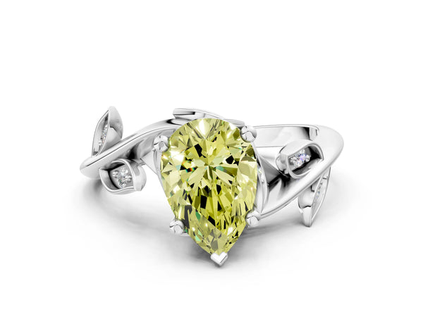 White gold Fancy Yellow Pear Cut Solitaire Twist Engagement Ring with Leaf Accents and Prong Setting