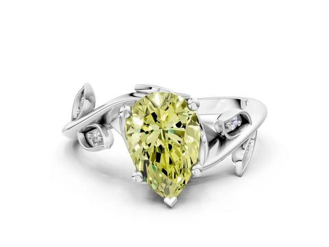 White gold Fancy Yellow Pear Cut Solitaire Twist Engagement Ring with Leaf Accents and Prong Setting