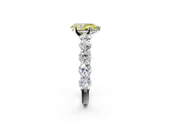Platinum Fancy Yellow Pear Cut Diamond Prong Setting with Side Stones on a Pave Band