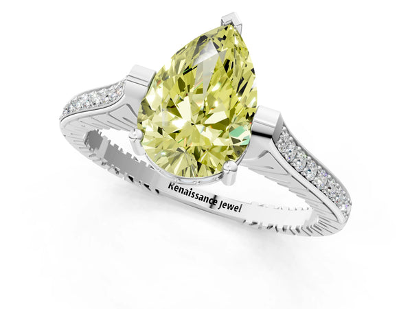 White gold Fancy Yellow Pear  Solitaire Diamond Ring with Channel Set Band and Bezel Prong Setting