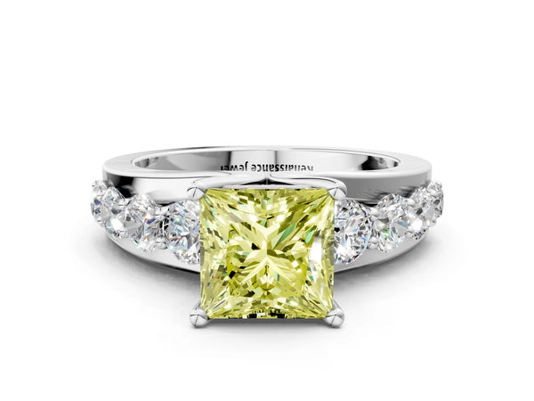 White gold Fancy Yellow Princess  Brilliant Solitaire with Side Stones on a Pave Band and Four-Prong Setting