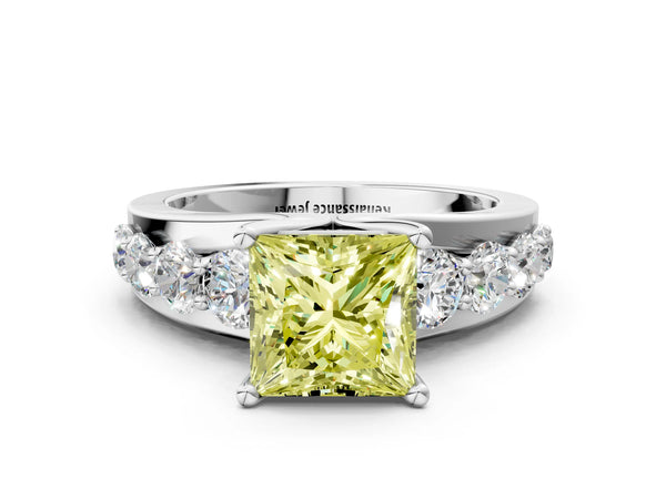 White gold Fancy Yellow Princess  Brilliant Solitaire with Side Stones on a Pave Band and Four-Prong Setting