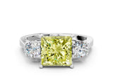 White gold Fancy Yellow Princess Cut Diamond Three-Stone Engagement Ring with Prong Setting and Pavé Band